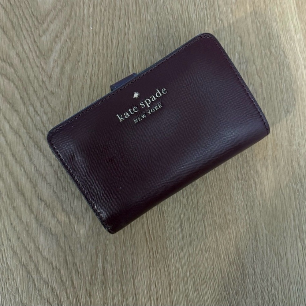 kate spade burgundy leather compact wallet with gold logo